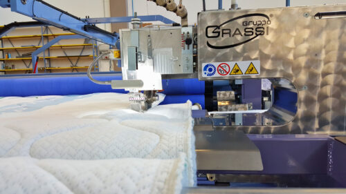 Quilted panel cutting machines